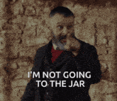 a man with a beard pointing at the camera with the words i 'm not going to the jar