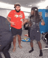 a man in a red shirt with the number 41 on it is dancing