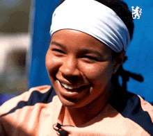 a woman wearing a headband with a lion logo on it