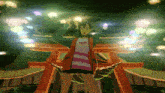 a girl in a striped shirt is standing in front of a red torii gate