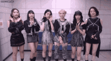 a group of girls standing next to each other with the url honeycam.org at the bottom