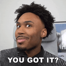 a man with a beard is smiling and says you got it