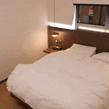 a hotel room with a bed and a nightstand