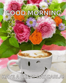 a bouquet of flowers and a cup of coffee with a smiley face