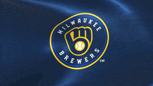a blue and yellow milwaukee brewers logo on a blue background