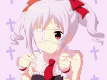 a girl wearing a bandage on her eye is pointing up