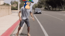 a man wearing a monkey mask is walking down a street .