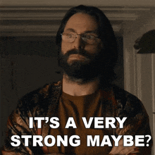 a man with glasses and a beard is asking if it 's a very strong maybe