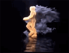 a silhouette of a man is surrounded by smoke and fire