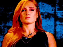 a woman with red hair is wearing a black top and necklace