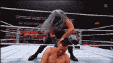 a wrestler in a ring with the word raw on the bottom