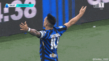 a soccer player with the number 10 on his jersey celebrates