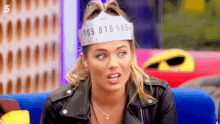 a woman wearing a headband with numbers on it .