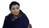 a woman in a blue shawl is making a sad face