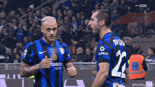 two soccer players one with the number 22 on his shirt