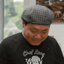 a man wearing a chef rang t-shirt says taste