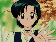 a girl with a choker around her neck is waving