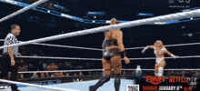 two women are wrestling in a ring with a netflix ad behind them