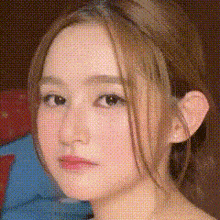 a close up of a girl 's face with a polka dot pattern
