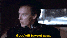 a man in a car with the words goodwill toward men below him