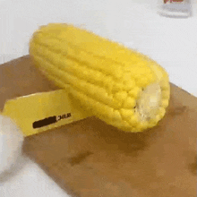 Slicing A Corn That Little Puff GIF - Slicing A Corn That Little Puff Chopping A Corn GIFs