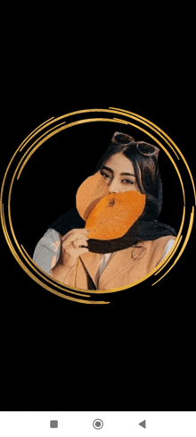 a woman is covering her face with a leaf in a circle .
