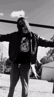 a black and white photo of a person wearing a shirt that says 2njk