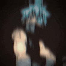 a blurry picture of a person 's face with a light shining through it