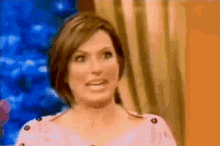 a close up of a woman 's face with a blurred background