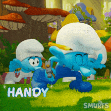 a smurf named handy is holding a cell phone in his hand