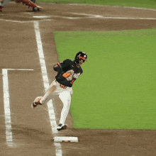 a baseball player in a black jersey with the number 22 on it