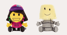 two stuffed toys one of which says tough guys wear pink