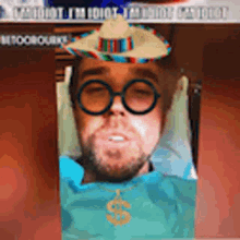 a man wearing a sombrero and glasses is laying in a chair
