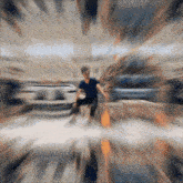 a blurry picture of a man in a blue shirt running