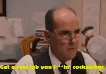 a man in a suit and tie says " get a real job you f *** in cocksucker "