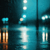 a blurred image of a city street in the rain