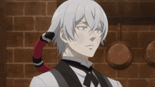 a man with a snake tail on his hair