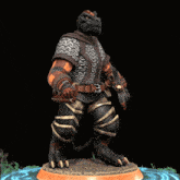 a statue of a man with a sword and chain mail on