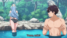 a man and a woman are standing in a pool with vamos entao written on the bottom
