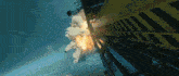 a large explosion is coming out of a yellow building that says waltz