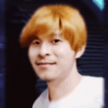 a close up of a man 's face with a wig on .