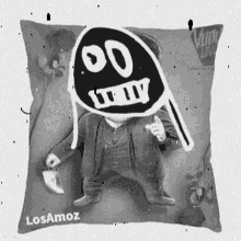 a black and white pillow with a drawing of a man on it and the name losamos on it