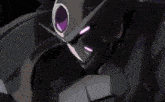 a close up of a purple light on a black surface