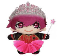 a stuffed animal wearing a tiara and holding a wand