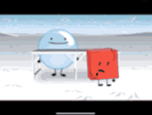 a blue ball and a red cube are standing next to each other in the snow