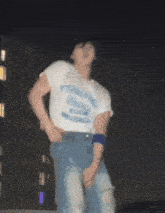 a person wearing a white shirt with the word york on it is dancing