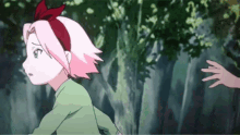a girl with pink hair and a bow on her head is running away from another girl .