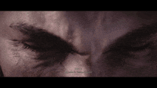 a close up of a person 's face with the words " wayne " written on the bottom