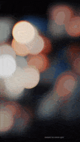 a blurred image of lights with the words created by akinor qpm