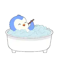 a blue and white penguin is taking a bath in a tub